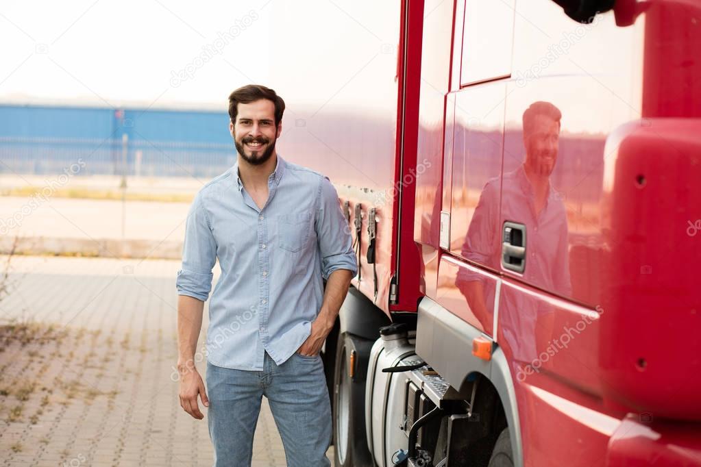 handsome truck driver standing outside