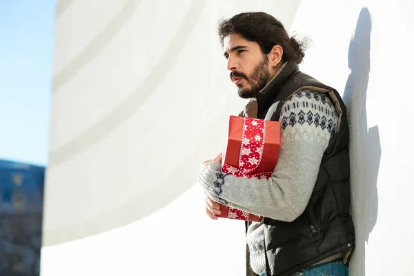 Young man with red gift concept