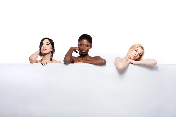 Diversity ethnicity women over an empty panel — Stock Photo, Image