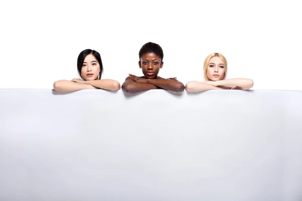 Diversity ethnicity women over an empty panel — Stock Photo, Image