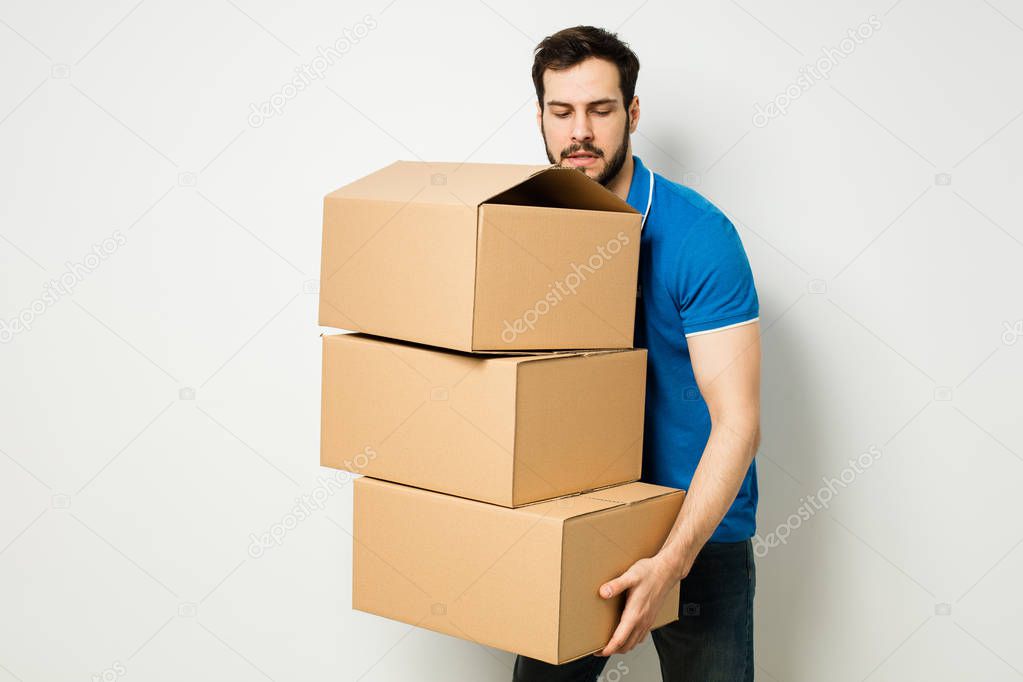 young man with a cardboard box in his arms