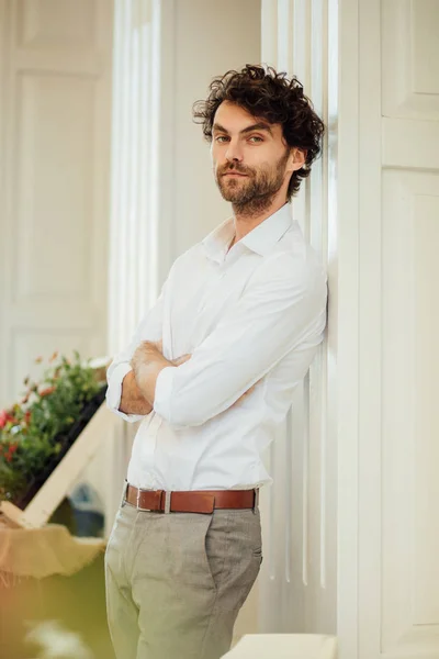 handsome elegant man stanting outside at terrace