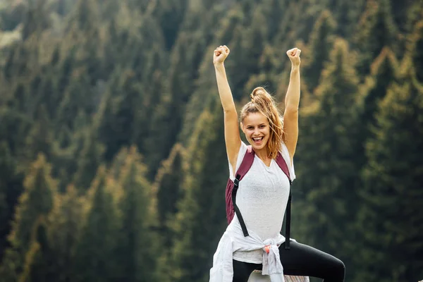 single woman on top of the mountains