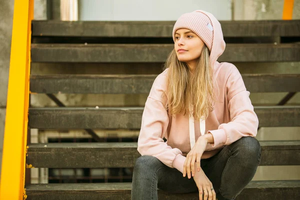Cool young woman in pink hoodie — Stock Photo, Image