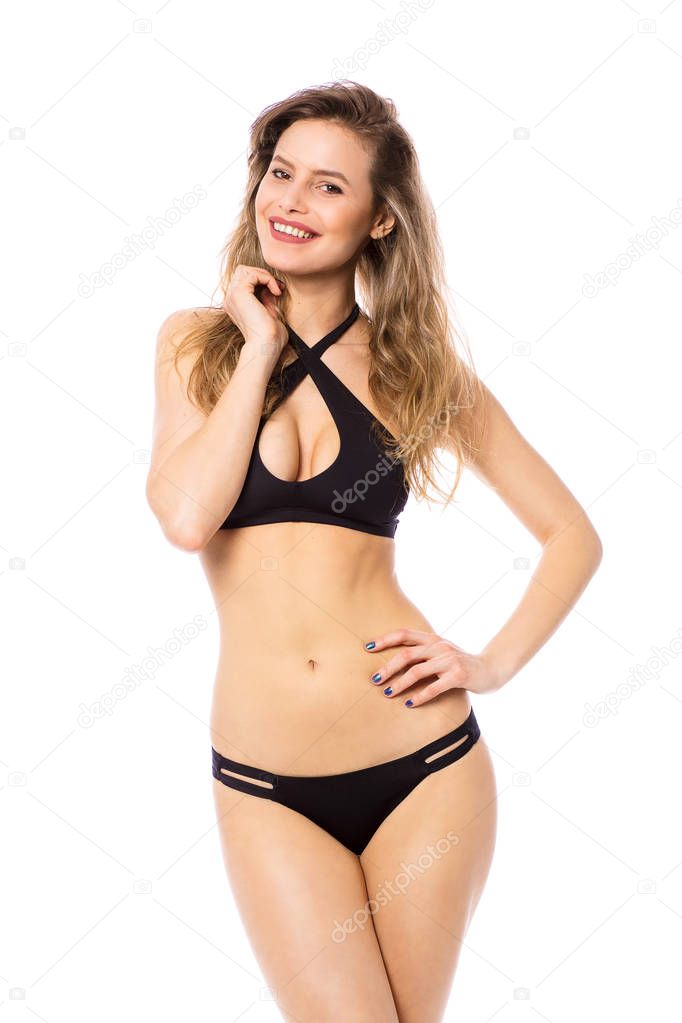 Studio shot of a young woman in a bikini isolated on white - Stock Photo