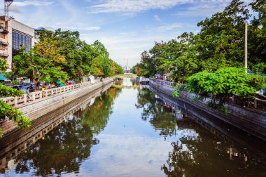 Calm water in the channel with blue sky on the background