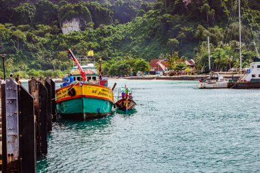 Colored small boat near the pier on Phi Phi island in Thailand