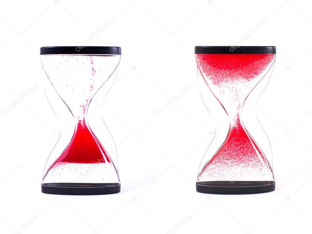 Red sand clock isolated on white background. Close up.