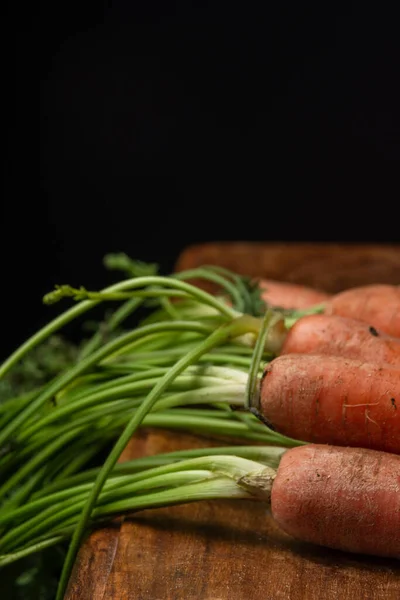 Close Detail Carrots Green Leaves Selective Focus Wooden Table Black — Stock Photo, Image