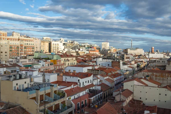 View of buildings and roofs from terrace, with cloudy sky at sunset, in Madrid, Spain, Europe, horizontal