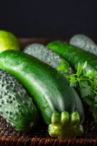 Top View Pumpkins Cucumbers Parsley Avocado Selective Focus Basket Dark — Stock Photo, Image