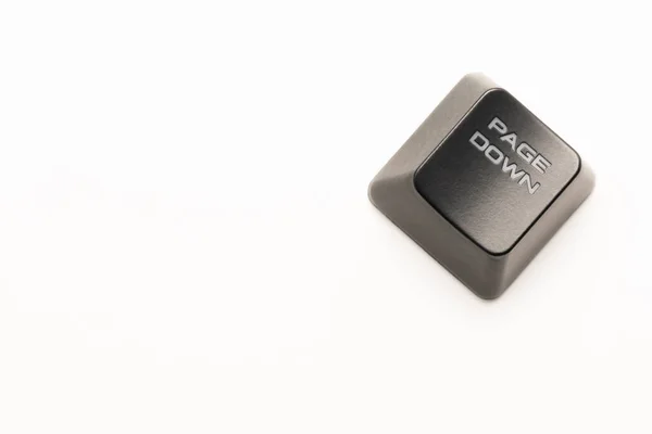 Černé tlačítko klávesnice s bílým nápisem Page Down v rohu na bílém pozadí — Stock fotografie
