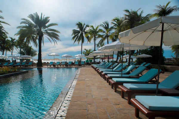 Umbrella pool and chair — Stock Photo, Image