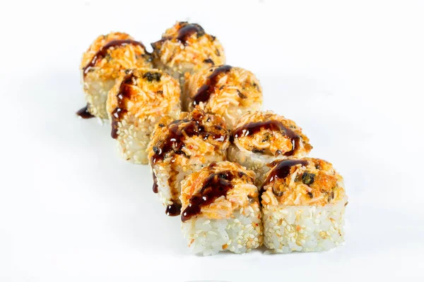 baked sushi rolls with red fish, teriyaki sauce, sesame seeds, on an isolated white background