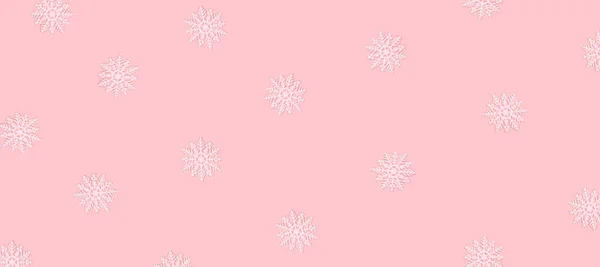 Winter pattern made of snowflakes and on pink background. — Stock Photo, Image