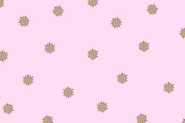 Winter pattern made of snowflakes and on pink background. — Stock Photo, Image