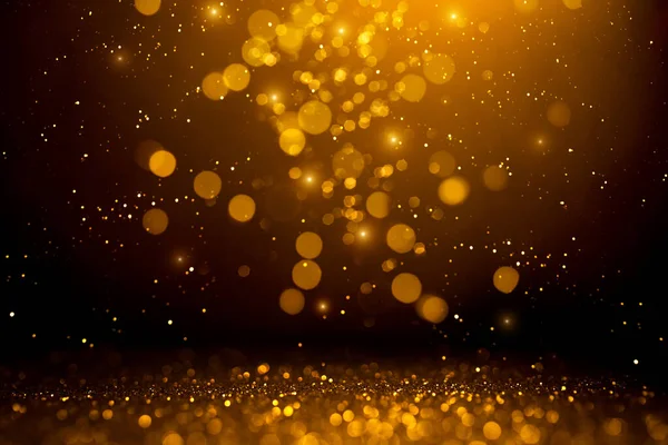 Goldenes abstraktes Bokeh auf schwarzem Hintergrund. — Stockfoto