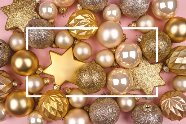 Festive pink background with gold and silver Christmas balls.