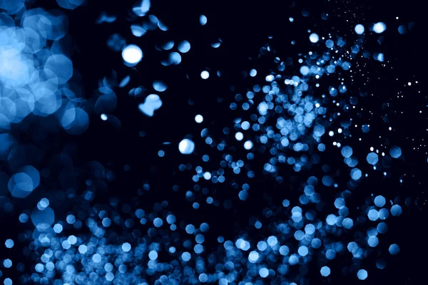 Blu bokeh astratto su sfondo nero . — Foto Stock