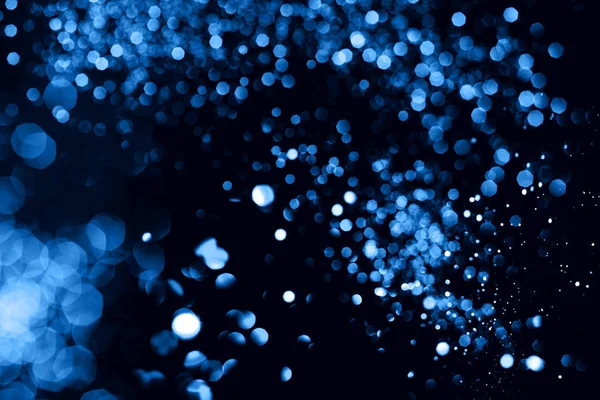 Blu bokeh astratto su sfondo nero . — Foto Stock