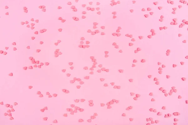 Рожевий фон з крихітними серцями. Валентинів день.. — стокове фото