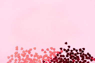 Pink background with red hearts. Valentine's day concept.