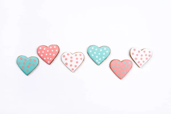 Gingerbread cookies with frosting in the shape of a heart on white background. — 스톡 사진