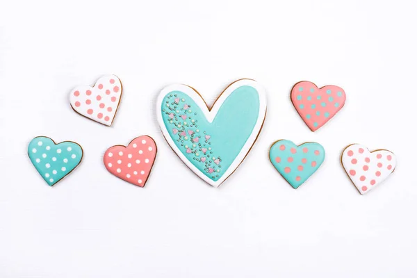Gingerbread cookies with frosting in the shape of a heart on white background. — 스톡 사진