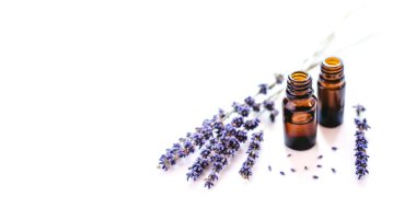 Dried lavender with a bottle of essential oil clipart