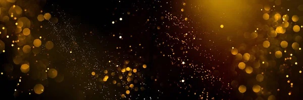 Siyah arkaplanda altın soyut bokeh.