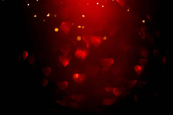 Tło z czerwonym bokeh w kształcie serca. — Zdjęcie stockowe