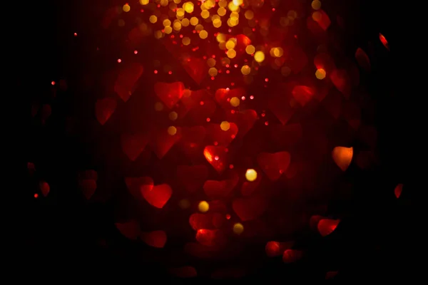 Fondo con bokeh rojo en forma de corazón . — Foto de Stock