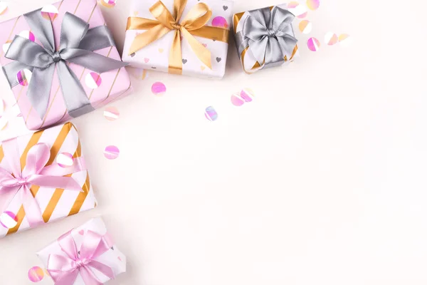 Several gift boxes with bows and confetti on a white background. — 스톡 사진