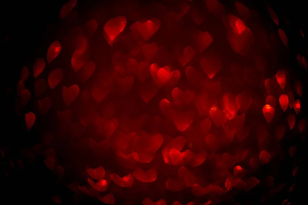 Tło z czerwonym bokeh w kształcie serca. — Zdjęcie stockowe