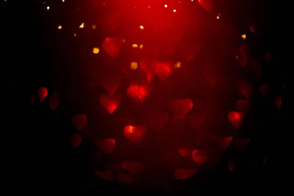 Pozadí s červeným bokeh ve tvaru srdce. — Stock fotografie
