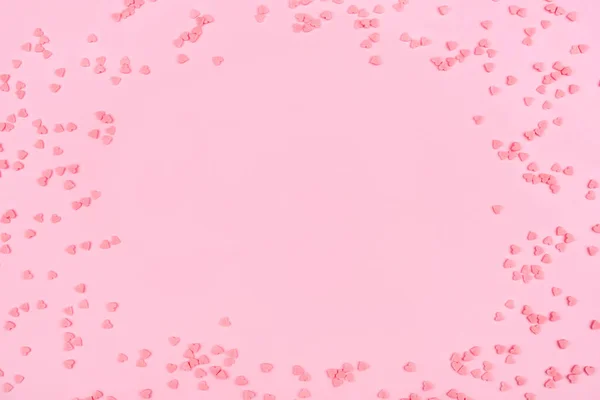 Рожевий фон з крихітними серцями. Валентинів день.. — стокове фото