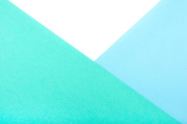 Beyaz, yeşil ve mavi pastel kartonların soyut geometrik arkaplanı.