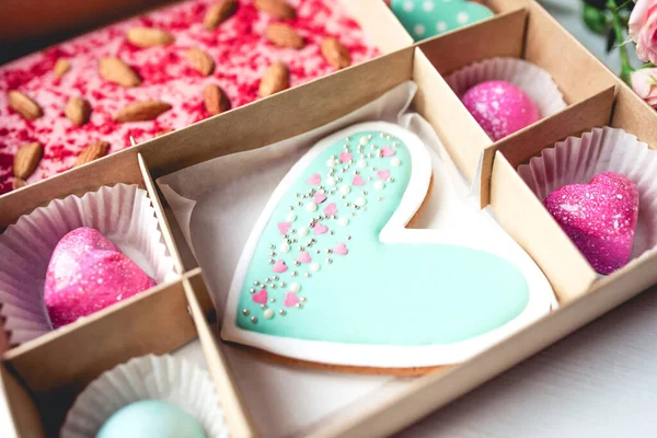 Gift set with hand made sweets in a box on a white table. — ストック写真