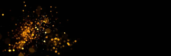 Golden abstract bokeh on black background. — Stock Photo, Image