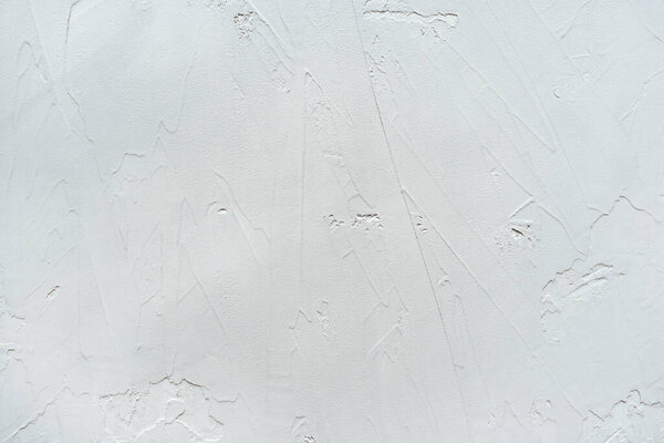 Texture of grey putty applied to the wall.