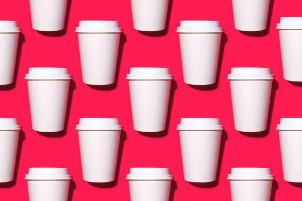 Pattern of disposable coffee cups on a red background.