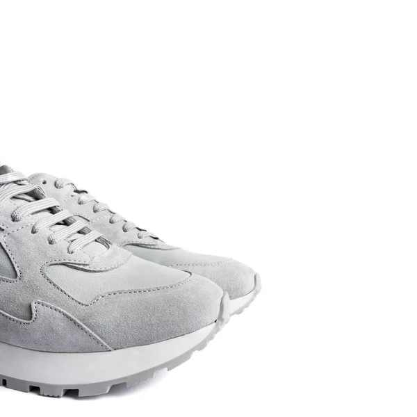 Sneakers grigie isolate su sfondo bianco . — Foto Stock
