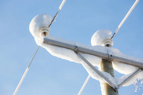 Snow covered power lines closeup