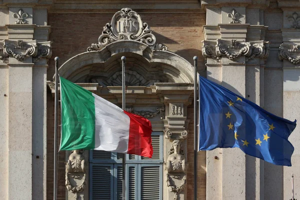 Italian and European Union flags in the wind on the public palace — Stock Photo, Image