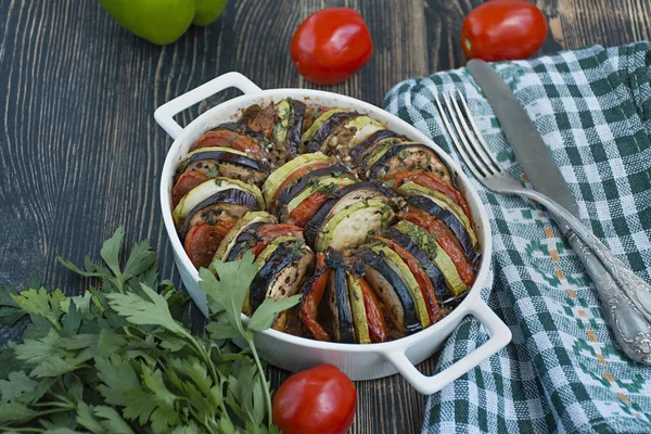 Ratatouille is a traditional French vegetable dish cooked in the oven. Diet vegetarian dish. Balanced nutrition. Eco food. Space for text.