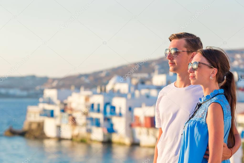 Family in Europe. Young couple on Little Venice background on Mykonos Island, in Greece