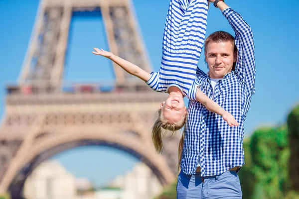 Beautiful happy family in Paris background Eiffel Tower