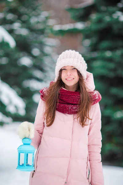 Winter beauty. Woman holding Christmas lantern outdoors on beautiful winter snow day — Stock Photo, Image