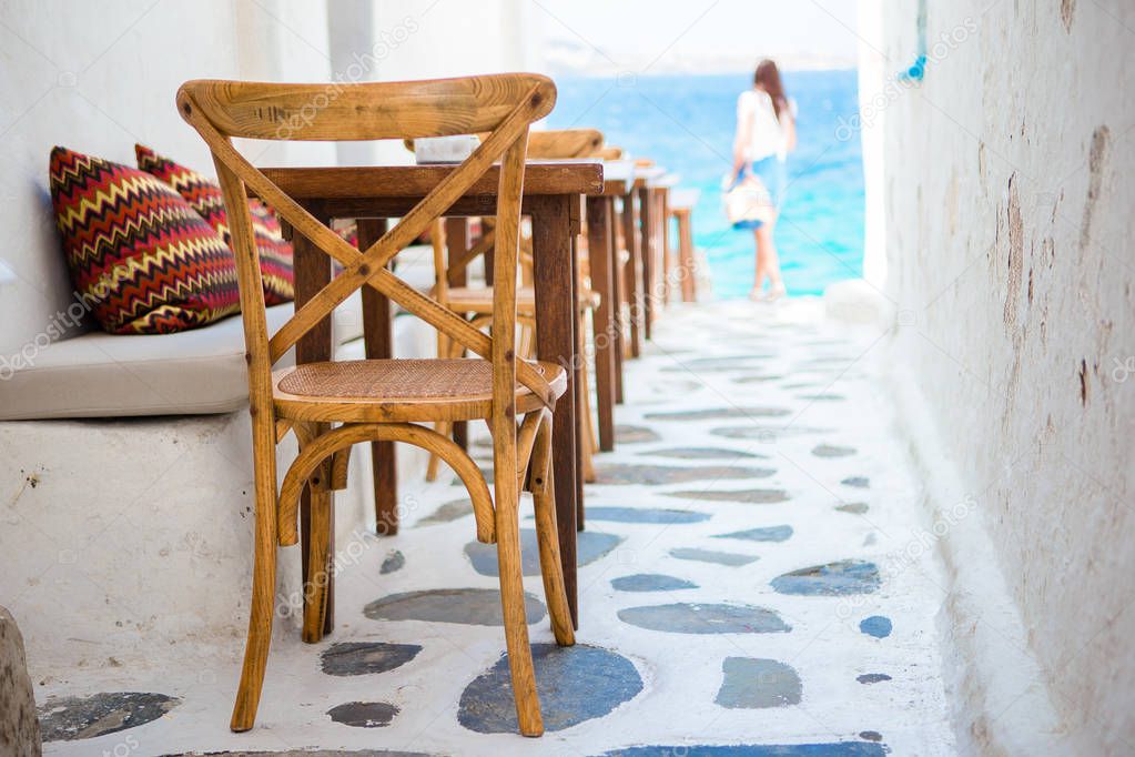 Beautiful typical greek outdoor cafe in Mykonos with amazing sea view on Cyclades islands