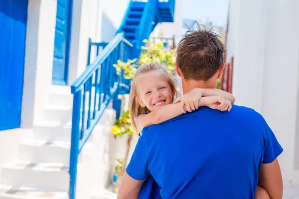 Back view of happy dad and little adorable girl in old village outdoors — Stock Photo, Image